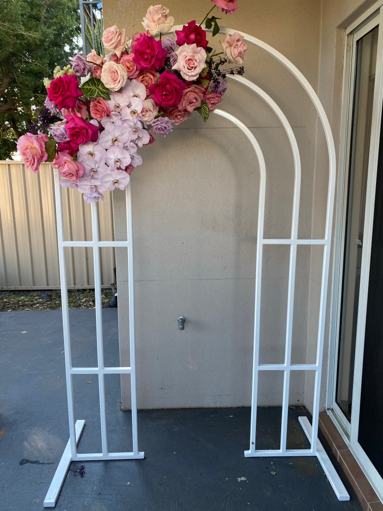 The Cartia white arch with custom signage – Arabella Events